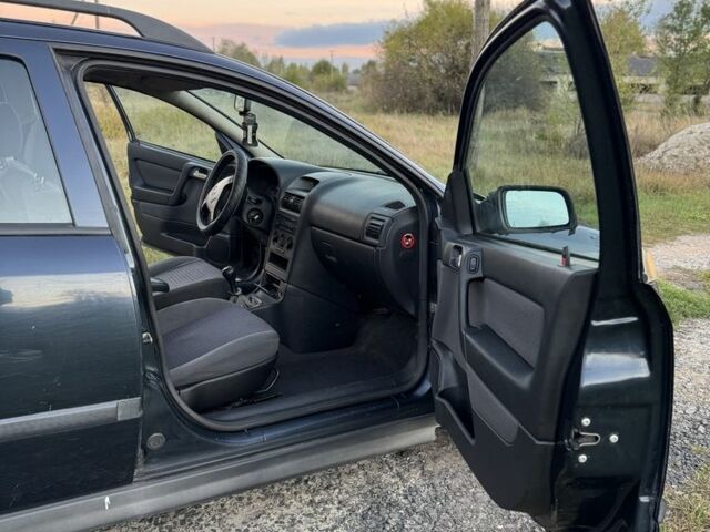 Синий Опель Астра, объемом двигателя 2 л и пробегом 250 тыс. км за 2350 $, фото 12 на Automoto.ua