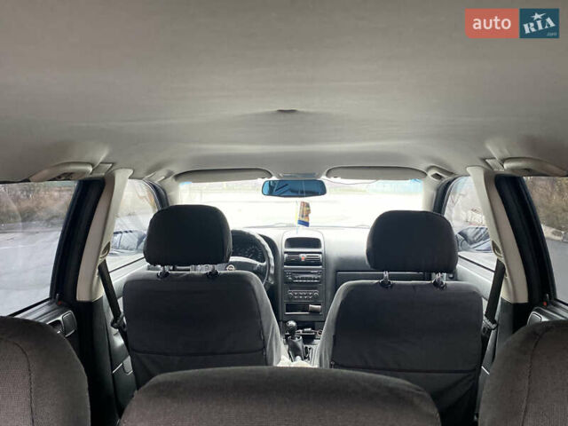 Синий Опель Астра, объемом двигателя 1.69 л и пробегом 353 тыс. км за 3500 $, фото 11 на Automoto.ua