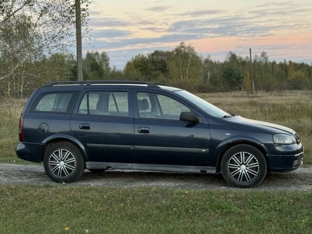 Синий Опель Астра, объемом двигателя 2 л и пробегом 250 тыс. км за 2350 $, фото 2 на Automoto.ua