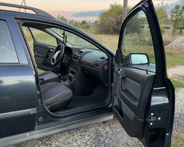 Синий Опель Астра, объемом двигателя 2 л и пробегом 250 тыс. км за 2350 $, фото 14 на Automoto.ua