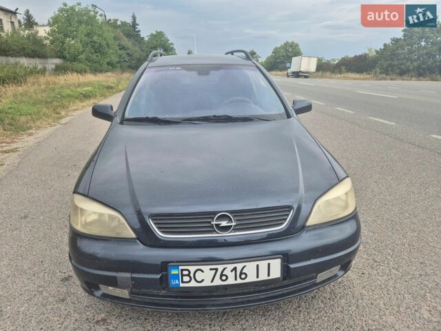 Синій Опель Астра, об'ємом двигуна 2 л та пробігом 300 тис. км за 1599 $, фото 2 на Automoto.ua