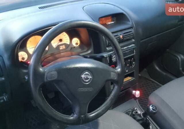 Синий Опель Астра, объемом двигателя 1.7 л и пробегом 350 тыс. км за 2300 $, фото 4 на Automoto.ua