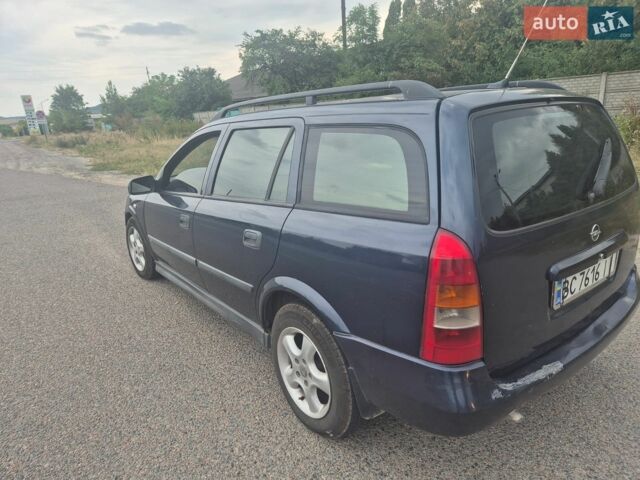Синій Опель Астра, об'ємом двигуна 2 л та пробігом 300 тис. км за 1799 $, фото 6 на Automoto.ua