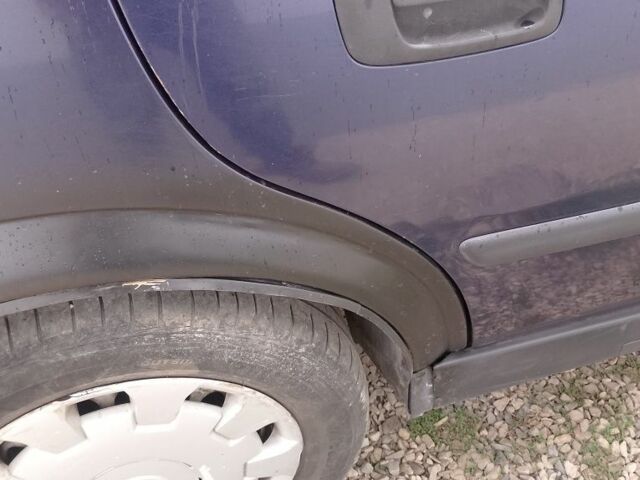 Синий Опель Астра, объемом двигателя 1.7 л и пробегом 401 тыс. км за 2400 $, фото 3 на Automoto.ua