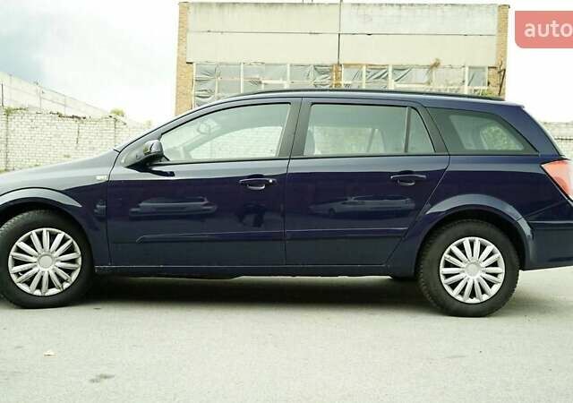 Синий Опель Астра, объемом двигателя 1.6 л и пробегом 240 тыс. км за 3799 $, фото 4 на Automoto.ua