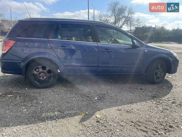 Синий Опель Астра, объемом двигателя 1.2 л и пробегом 338 тыс. км за 3800 $, фото 1 на Automoto.ua