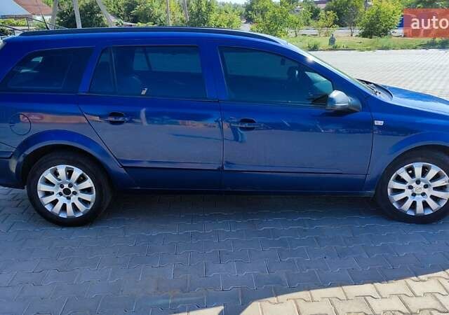 Синий Опель Астра, объемом двигателя 1.2 л и пробегом 328 тыс. км за 4600 $, фото 6 на Automoto.ua