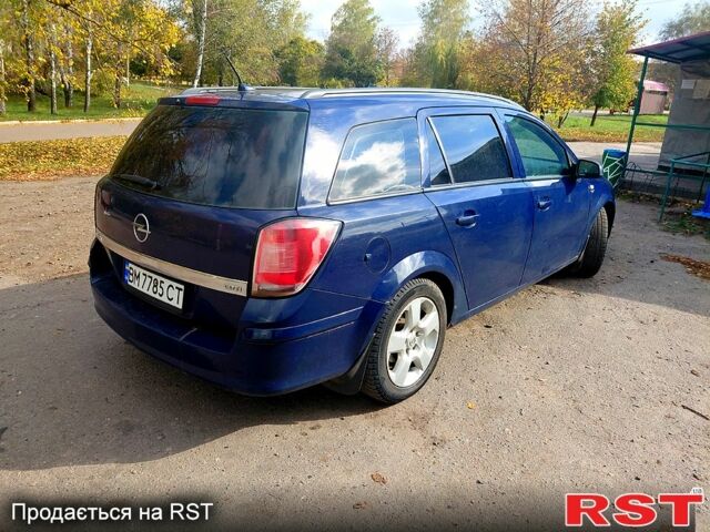Синий Опель Астра, объемом двигателя 1.2 л и пробегом 330 тыс. км за 4200 $, фото 2 на Automoto.ua