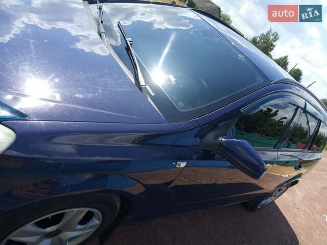 Синий Опель Астра, объемом двигателя 1.25 л и пробегом 200 тыс. км за 5200 $, фото 1 на Automoto.ua