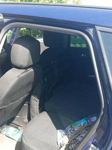 Синий Опель Астра, объемом двигателя 1.3 л и пробегом 248 тыс. км за 6600 $, фото 2 на Automoto.ua