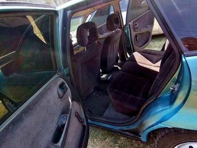 Зеленый Опель Астра, объемом двигателя 1.4 л и пробегом 400 тыс. км за 670 $, фото 3 на Automoto.ua