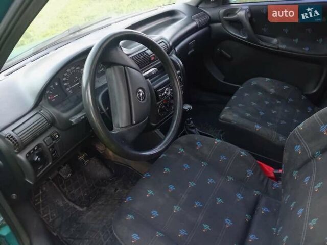 Зеленый Опель Астра, объемом двигателя 1.6 л и пробегом 253 тыс. км за 1299 $, фото 1 на Automoto.ua