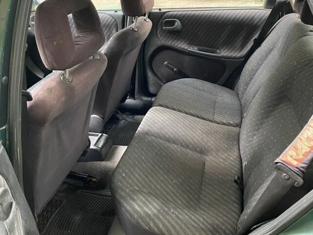 Зеленый Опель Астра, объемом двигателя 1.4 л и пробегом 342 тыс. км за 642 $, фото 4 на Automoto.ua