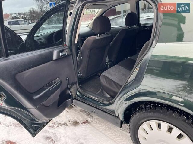 Зелений Опель Астра, об'ємом двигуна 1.4 л та пробігом 325 тис. км за 2350 $, фото 5 на Automoto.ua