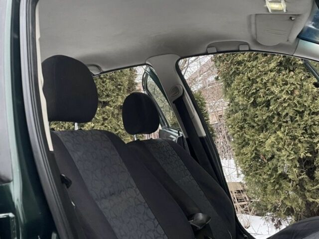 Зеленый Опель Астра, объемом двигателя 1.4 л и пробегом 400 тыс. км за 1800 $, фото 3 на Automoto.ua