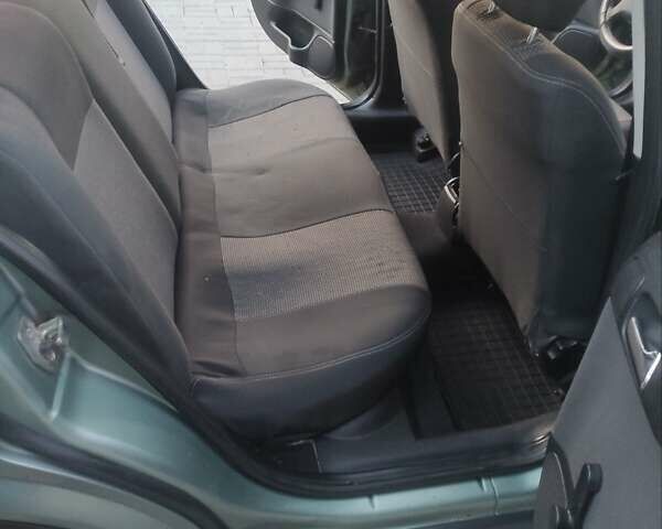 Зеленый Опель Астра, объемом двигателя 1.4 л и пробегом 296 тыс. км за 3300 $, фото 12 на Automoto.ua