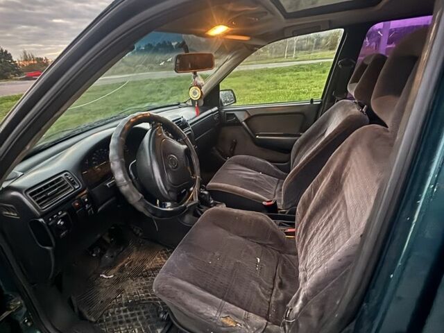 Зеленый Опель Астра, объемом двигателя 1.6 л и пробегом 491 тыс. км за 850 $, фото 4 на Automoto.ua