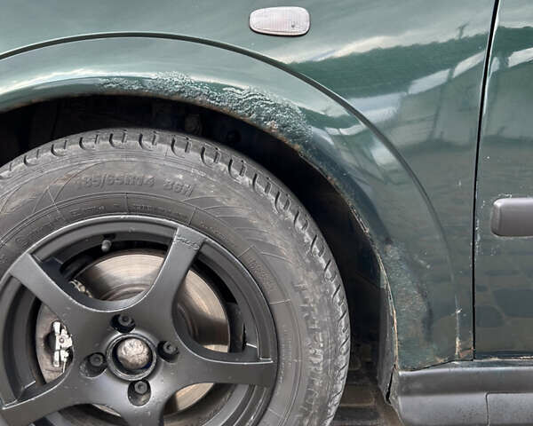 Зеленый Опель Астра, объемом двигателя 1.4 л и пробегом 262 тыс. км за 4000 $, фото 7 на Automoto.ua