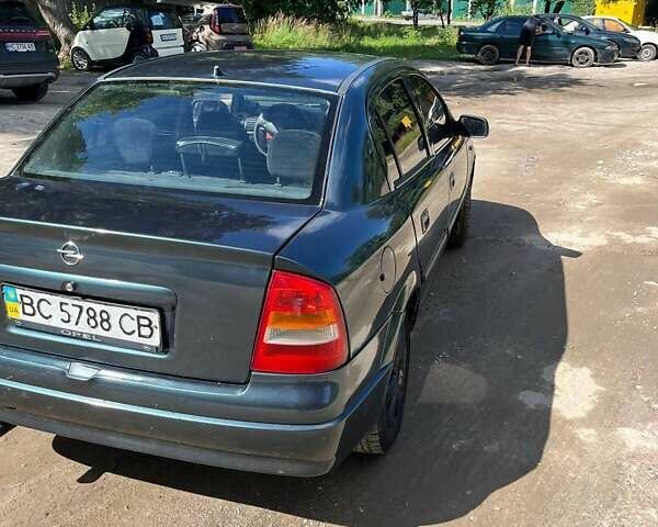 Зелений Опель Астра, об'ємом двигуна 1.4 л та пробігом 210 тис. км за 2000 $, фото 10 на Automoto.ua