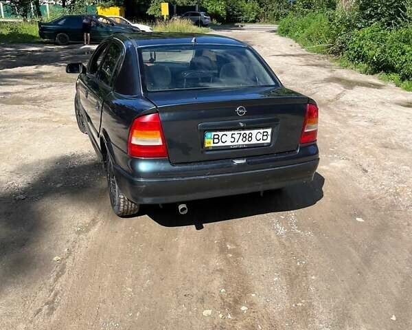 Зелений Опель Астра, об'ємом двигуна 1.4 л та пробігом 210 тис. км за 2000 $, фото 4 на Automoto.ua