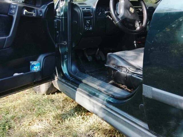 Зеленый Опель Астра, объемом двигателя 1.6 л и пробегом 320 тыс. км за 2043 $, фото 7 на Automoto.ua