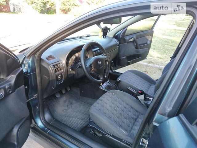 Зеленый Опель Астра, объемом двигателя 1.6 л и пробегом 230 тыс. км за 3500 $, фото 11 на Automoto.ua