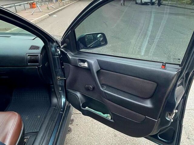 Зеленый Опель Астра, объемом двигателя 1.4 л и пробегом 235 тыс. км за 3000 $, фото 6 на Automoto.ua