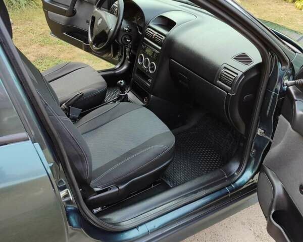 Зеленый Опель Астра, объемом двигателя 1.4 л и пробегом 182 тыс. км за 3500 $, фото 10 на Automoto.ua