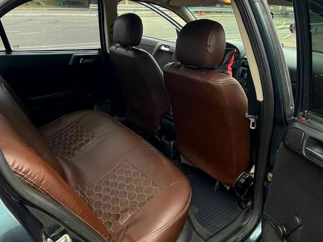 Зеленый Опель Астра, объемом двигателя 1.4 л и пробегом 235 тыс. км за 3000 $, фото 4 на Automoto.ua