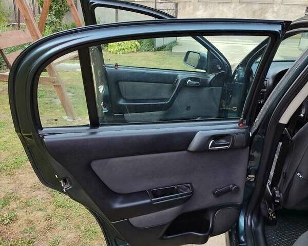 Зеленый Опель Астра, объемом двигателя 1.4 л и пробегом 182 тыс. км за 3500 $, фото 16 на Automoto.ua