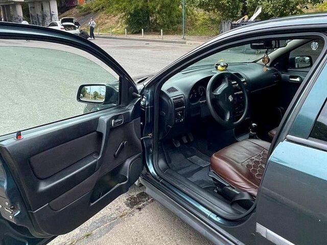 Зеленый Опель Астра, объемом двигателя 1.4 л и пробегом 235 тыс. км за 3000 $, фото 5 на Automoto.ua