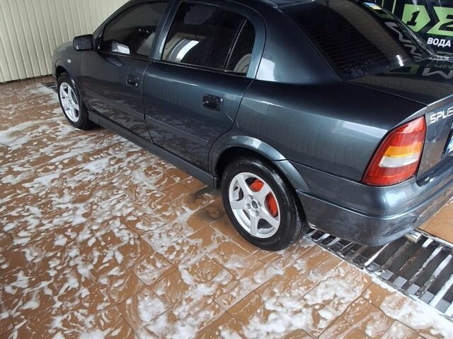 Зелений Опель Астра, об'ємом двигуна 1.4 л та пробігом 200 тис. км за 3000 $, фото 4 на Automoto.ua