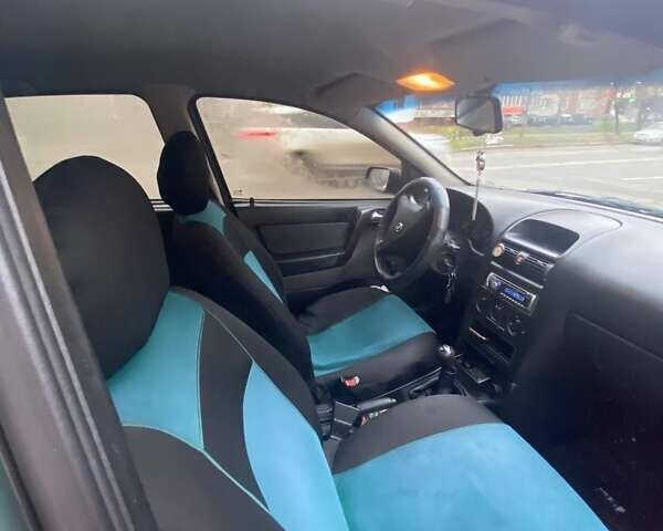 Зелений Опель Астра, об'ємом двигуна 1.39 л та пробігом 188 тис. км за 3342 $, фото 9 на Automoto.ua
