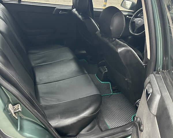 Зеленый Опель Астра, объемом двигателя 1.6 л и пробегом 260 тыс. км за 2350 $, фото 6 на Automoto.ua