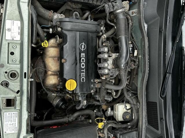 Зеленый Опель Астра, объемом двигателя 1.4 л и пробегом 235 тыс. км за 4000 $, фото 7 на Automoto.ua