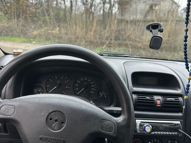 Зелений Опель Астра, об'ємом двигуна 1.6 л та пробігом 320 тис. км за 2499 $, фото 7 на Automoto.ua