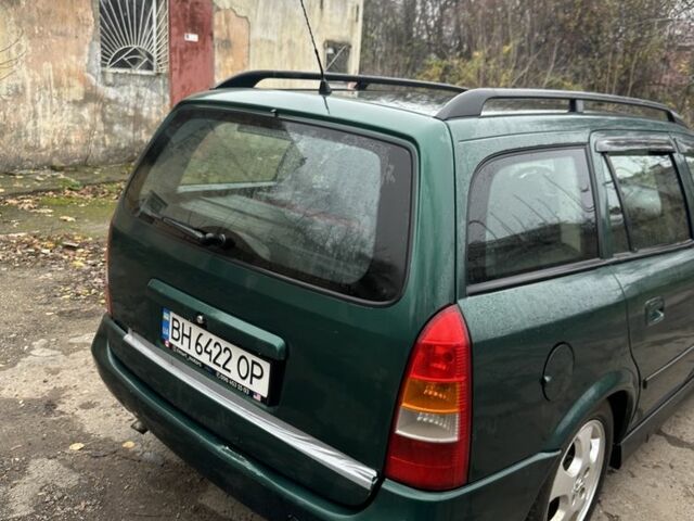 Зелений Опель Астра, об'ємом двигуна 1.6 л та пробігом 320 тис. км за 2499 $, фото 5 на Automoto.ua