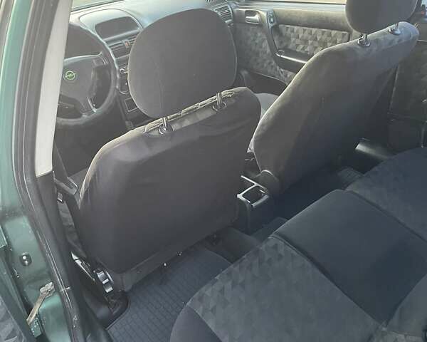 Зеленый Опель Астра, объемом двигателя 1.6 л и пробегом 227 тыс. км за 2100 $, фото 8 на Automoto.ua