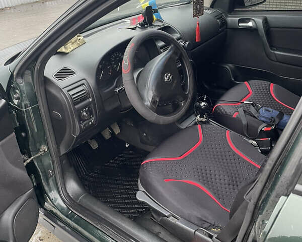 Зелений Опель Астра, об'ємом двигуна 1.69 л та пробігом 366 тис. км за 2300 $, фото 3 на Automoto.ua