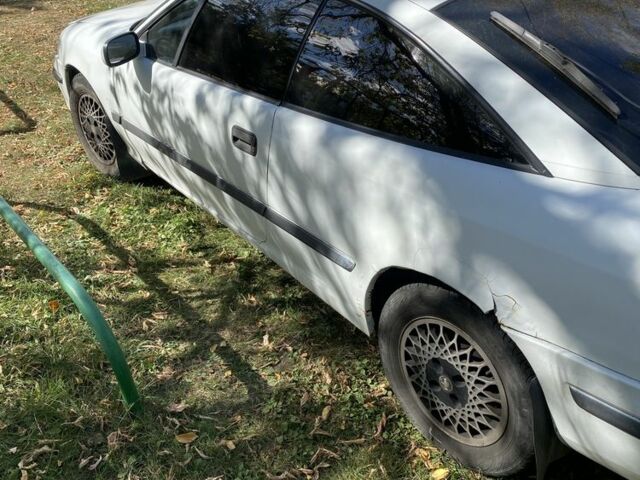 Белый Опель Калибра, объемом двигателя 2 л и пробегом 250 тыс. км за 1500 $, фото 5 на Automoto.ua