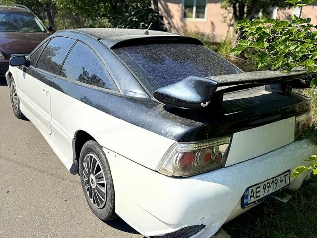 Білий Опель Калібра, об'ємом двигуна 2 л та пробігом 470 тис. км за 2700 $, фото 1 на Automoto.ua