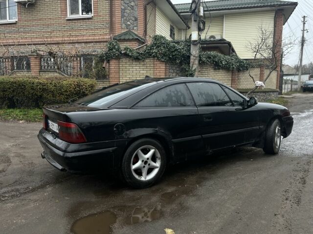 Черный Опель Калибра, объемом двигателя 2 л и пробегом 275 тыс. км за 2800 $, фото 3 на Automoto.ua