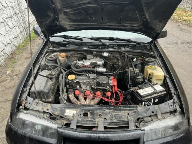 Черный Опель Калибра, объемом двигателя 2 л и пробегом 275 тыс. км за 2800 $, фото 6 на Automoto.ua