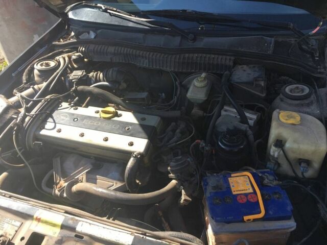 Черный Опель Калибра, объемом двигателя 2 л и пробегом 300 тыс. км за 1700 $, фото 4 на Automoto.ua