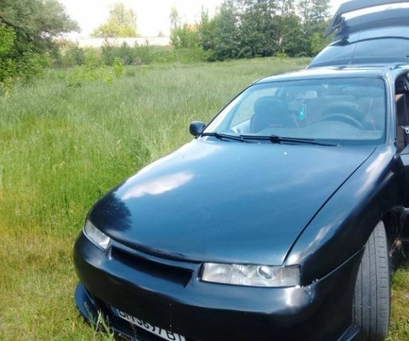 Чорний Опель Калібра, об'ємом двигуна 2 л та пробігом 520 тис. км за 2047 $, фото 1 на Automoto.ua