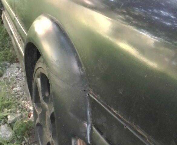 Чорний Опель Калібра, об'ємом двигуна 2 л та пробігом 520 тис. км за 2047 $, фото 9 на Automoto.ua