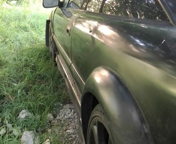 Чорний Опель Калібра, об'ємом двигуна 2 л та пробігом 520 тис. км за 2047 $, фото 10 на Automoto.ua