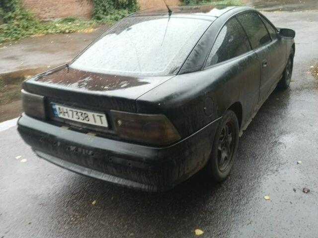 Чорний Опель Калібра, об'ємом двигуна 2 л та пробігом 330 тис. км за 3000 $, фото 2 на Automoto.ua