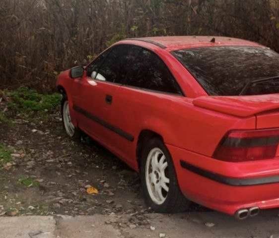 Красный Опель Калибра, объемом двигателя 2 л и пробегом 497 тыс. км за 1200 $, фото 1 на Automoto.ua