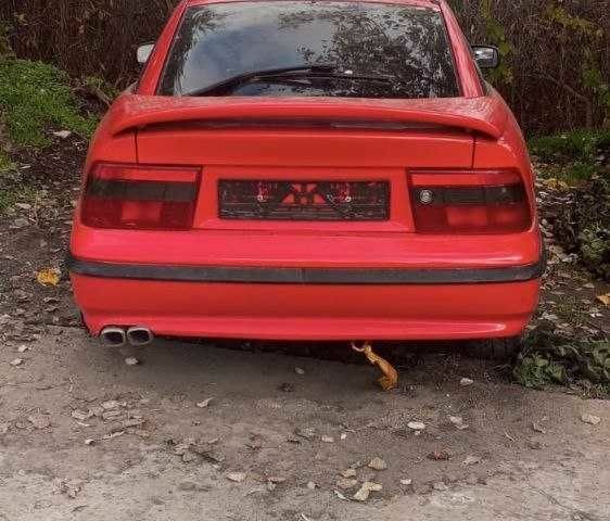 Красный Опель Калибра, объемом двигателя 2 л и пробегом 497 тыс. км за 1200 $, фото 3 на Automoto.ua